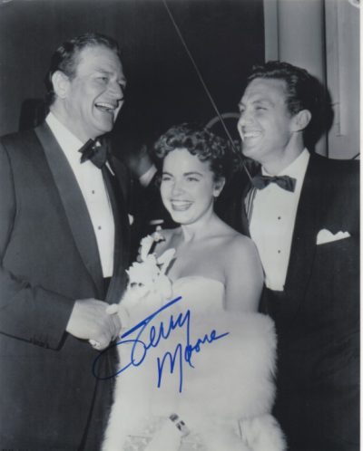 Terry Moore with John Wayne and Robert Stack